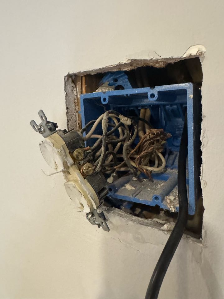 Electrician is repairing bad wiring 