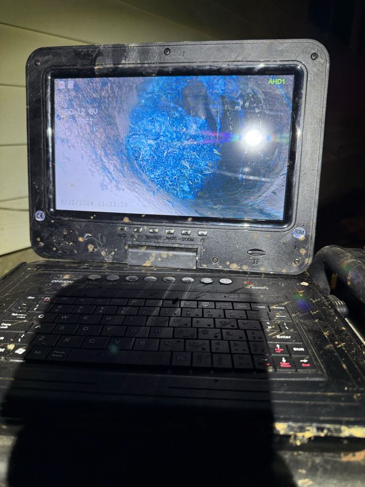 Responded to a home in the Alpharetta area for a main sewer line blockage causing drainage issues throughout the house. Performed a full main line clearing to restore proper flow to the system.

After clearing the blockage, we conducted a sewer camera inspection to identify the root cause of the issue. During the camera inspection, we found:
	•	Tree root intrusion inside the sewer line
	•	Multiple bellies (low spots) in the pipe holding water
	•	Signs of buildup and restriction in affected sections

Root intrusion is a common cause of recurring main line blockages, and pipe bellies can lead to standing water and ongoing drainage problems. Provided the homeowner with video footage and discussed repair and replacement options to prevent future backups.