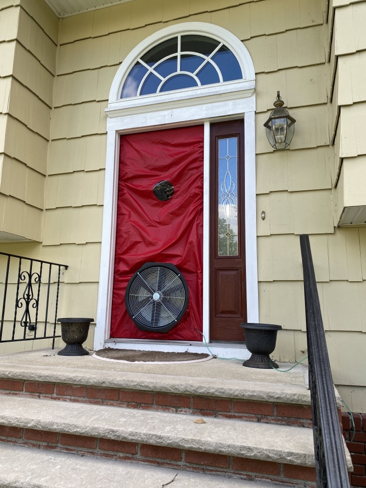 Denville, NJ - Preparing for a pre-installation blower door test in Denville, N.J. This test will let us know how drafty this home is. This house will have new siding installed & BASF Neopor insulation will be applied using liquid flashing. After the installation, NJIT will do a post blower door test to measure the effectiveness of the new insulation. Denville, NJ - Preparing for a pre-installation blower door test in Denville, N.J. This test will let us know how drafty this home is. This house will have new siding installed & BASF Neopor insulation will be applied using liquid flashing. After the installation, NJIT will do a post blower door test to measure the effectiveness of the new insulation.