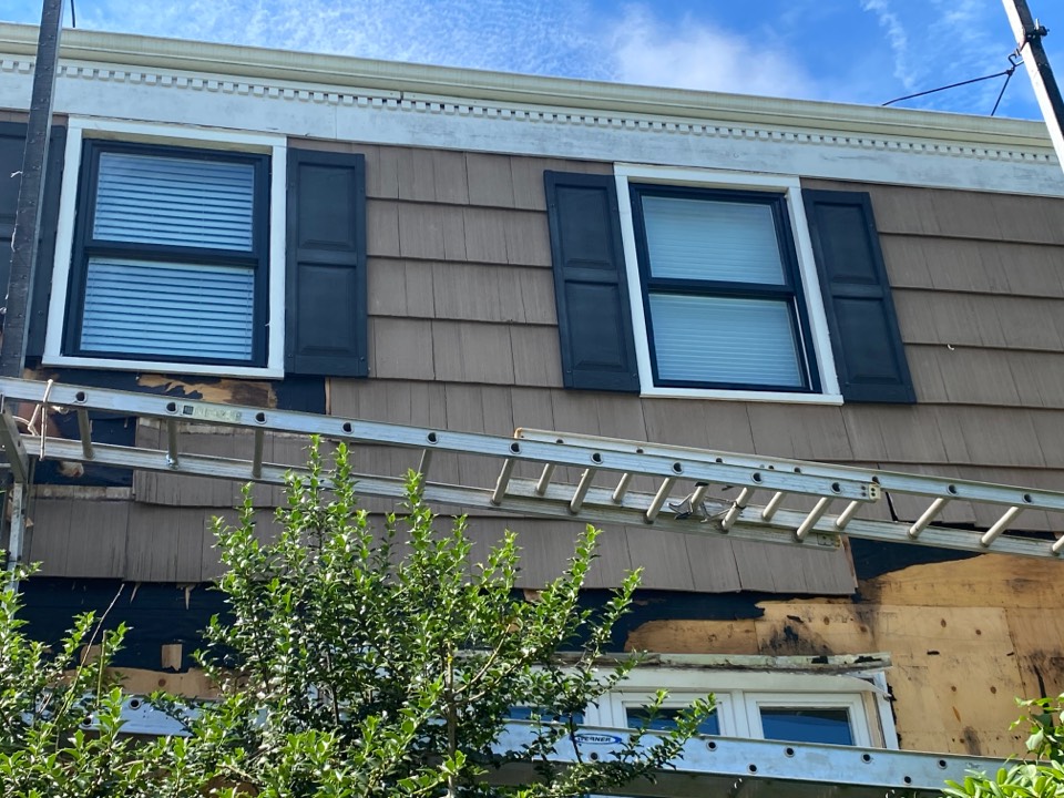 West Orange, NJ - Installing white James Hardie Board and Batten fiber cement siding & Harvey Tribute black exterior vinyl DH windows in West Orange, NJ West Orange, NJ - Installing white James Hardie Board and Batten fiber cement siding & Harvey Tribute black exterior vinyl DH windows in West Orange, NJ