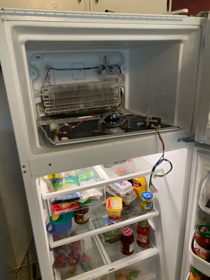 Replaced freezer fan motor on Frigidaire refrigerator that was not cooling.