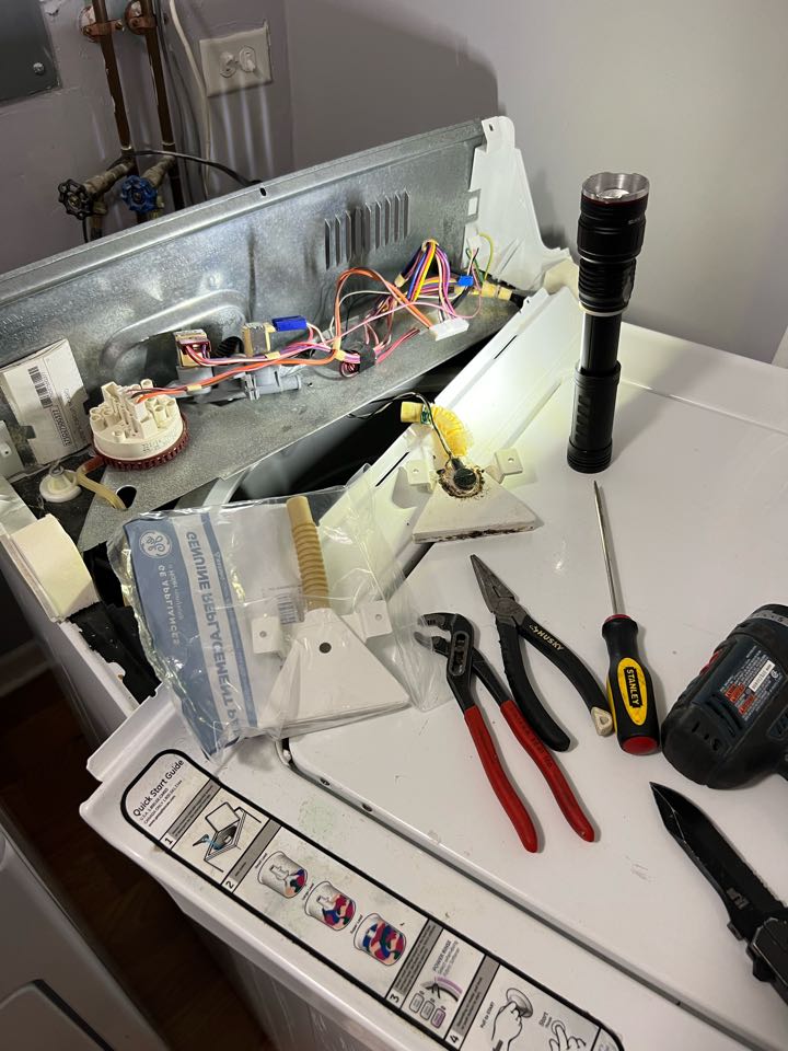 Replaced cracked water filter spout on GE washer Replaced cracked water filter spout on GE washer