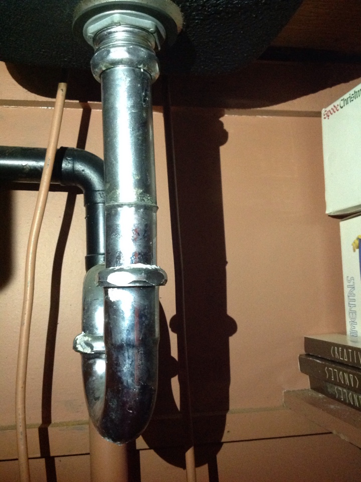 Replacing the wet bar sink , strainer , tail piece, and trap. 