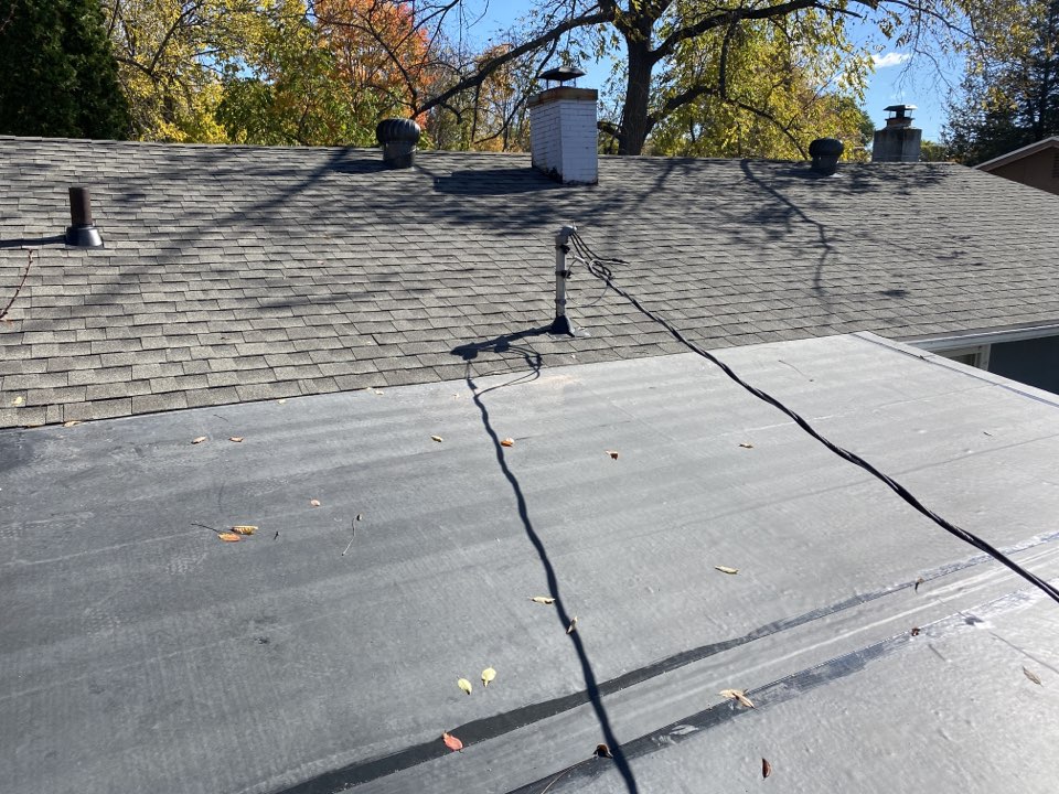 Brainerd, MN - We installed a new shingle roof in Brainerd with GAF Timberline HDZ in weathered wood and .60 rubber EDPM Brainerd, MN - We installed a new shingle roof in Brainerd with GAF Timberline HDZ in weathered wood and .60 rubber EDPM