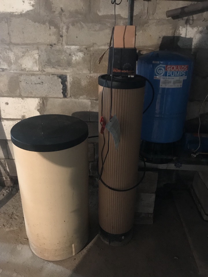 Testing well water on Abbet Road replacing an old water softening system the iron buster the Culligan water softening system with the water cure USA a Volvo water softer and ultraviolet light system with reverse osmosis