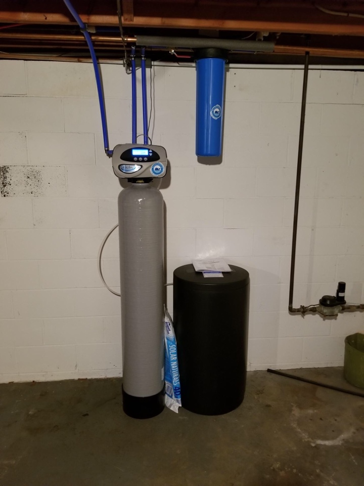 Replacing an old Culligan water softening system with the water carry USA water softener and reverse osmosis drinking water system the system has a whole house filter has an iron filter and has a sulfur filter is going to remove the bacteria and the chemicals in the water