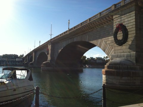 London Bridge over Lake Havasu, which is the lake formed by Parker Dam.  Parker Dam uses the Colorado River to generate electricity, half of which is used to operate pumping stations, which push Colorado River water to Southern California. From there, Mr Fix It Plumbing builds and maintains the plumbing systems that bring the water into your home.  So, at this moment, I am watching your drinking water drifting by!