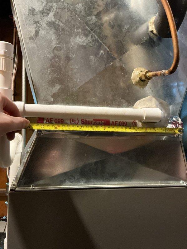 Responded to call back regarding furnace making loud humming noise. Conducted inspection and measurements of electrical components including motor/fan assembly and associated wiring connections. Checked PVC pipe placement and clearances, and verified proper installation specifications of recently installed 70,000 BTU furnace with humidifier.
