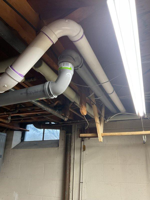 Completed warranty service on Navien combi unit installation. Installed polypropylene venting system with proper connections to existing plumbing network. System includes copper pipe connections, ball valves for maintenance access, and integration with home water filtration system.