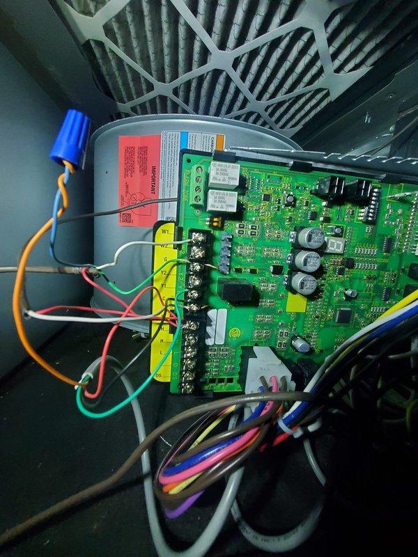 Diagnosed 15-year-old AC unit with frozen refrigerant line and intermittent operational noise. Inspection of control board and electrical components showed normal functionality with no visible damage or wear. System requires replacement due to age and refrigerant line issues.