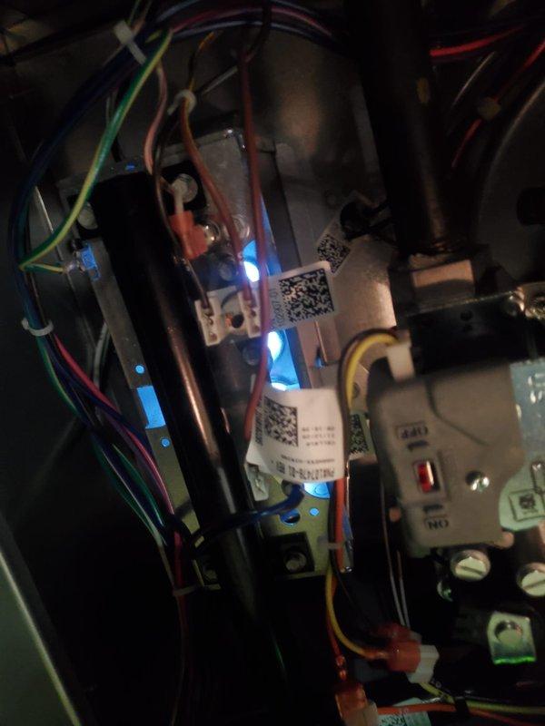 Diagnosed 15-year-old AC unit with frozen refrigerant line and intermittent operational noise. Inspection of control board and electrical components showed normal functionality with no visible damage or wear. System requires replacement due to age and refrigerant line issues.