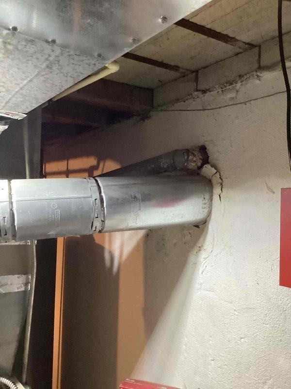 Performed comprehensive assessment for full system replacement of 10+ year old HVAC equipment. Inspection revealed deteriorated exhaust pipe connections at wall junction and aging ductwork with suboptimal configuration. Recommended complete furnace and air conditioning replacement with addition of zoning system to improve comfort and efficiency throughout the residence.