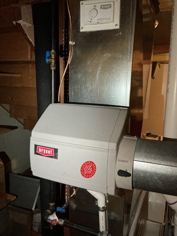 Conducted IAQ assessment on Bryant HVAC system installed in basement 5 months ago (under warranty) in response to customer complaint of "crammy" feeling and possible excess humidity. Inspected filter condition and system components, confirming proper installation of ductwork, copper lines, and control panel. Verified seasonal settings were properly configured for optimal indoor air quality.