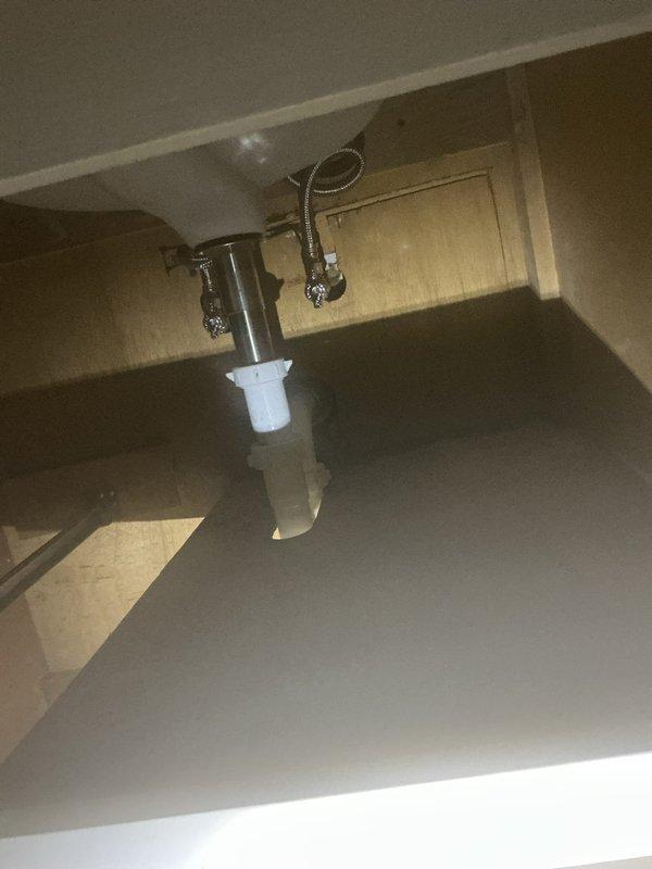 Successfully completed water meter rebuild and re-pipe service ahead of city-scheduled water shutoff. Replaced existing drain assembly with new PVC P-trap configuration and installed properly secured supply lines to ensure proper drainage and prevent future leaks. All connections were verified watertight and system is functioning optimally.