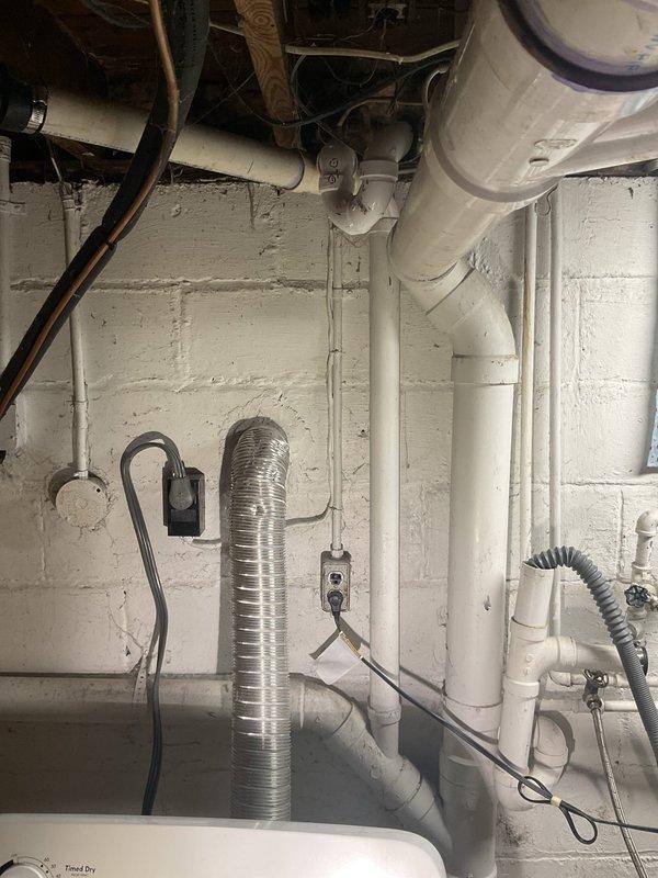 Responded to callback regarding water leak from PVC pipe behind washing machine after previous repair. Inspected utility area and found disconnected PVC drain pipe causing water to spew out. Reconnected and secured the pipe connection, then verified proper drainage and tested hot water functionality which was restored to normal operation.