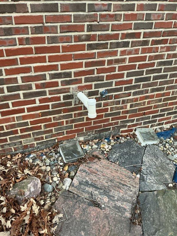 Conducted an estimate for replacement options on a 1999 HVAC system with multiple failures including seized blower motor and grinding inducer motor resulting in no heat. Presented customer with replacement options for furnace-only and complete furnace/AC system configurations, with additional humidifier installation options for both scenarios. System is located in basement of brick residential structure with existing outdoor condenser unit positioned on concrete pad against exterior wall.