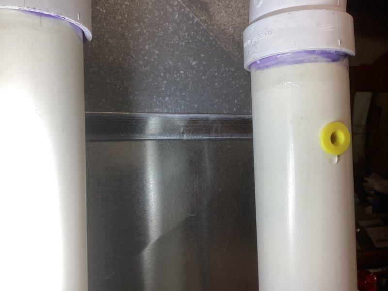 Completed Gold Furnace Inspection on 13-year-old forced air furnace located in basement. Inspected condensate drain system, noting properly installed PVC piping with appropriate primer application at joints and functional drain trap assembly. System appears to be in normal operating condition with no visible issues detected.