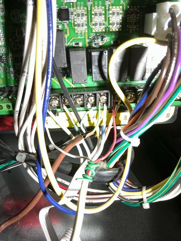 Responded to callback for water leakage issue on recently installed furnace. Inspected control board components and wiring connections, and examined plumbing configuration where water overflow was occurring. Identified and corrected issue with pressure regulator valve connection to prevent further water overflow from the hot water tank during furnace cycling.