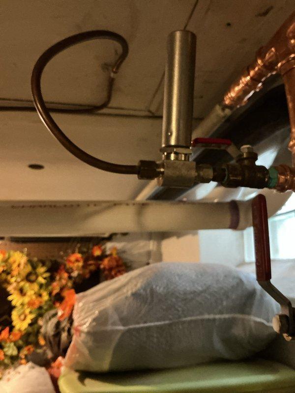 Responded to callback for water leakage issue on recently installed furnace. Inspected control board components and wiring connections, and examined plumbing configuration where water overflow was occurring. Identified and corrected issue with pressure regulator valve connection to prevent further water overflow from the hot water tank during furnace cycling.