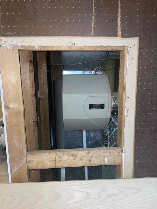 Conducted full system replacement estimate for aging HVAC unit with non-functioning blower. Inspection revealed existing Lennox system installed in utility area with proper ductwork connections, service switch labeled "DFCU Feeder #12," and standard condensate drainage setup. Documented current installation configuration including electrical connections and mounting platform to ensure appropriate replacement specifications.