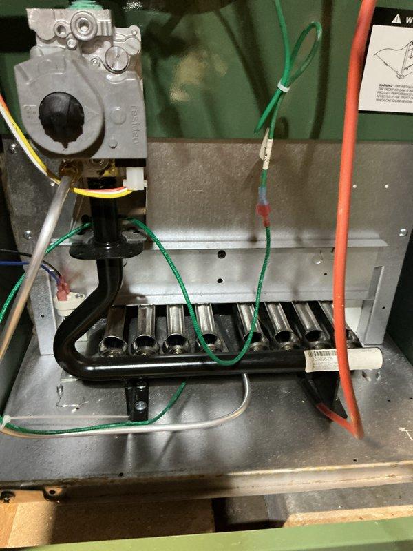 Performed city certification inspection on a 2-month-old HVAC system located in basement. Inspected gas valve assembly, burner tubes, and electrical control systems, finding all components in normal working condition. Verified proper operation of humidifier, thermostat, and hot water tank, with particular attention to the gas shutoff valve and copper piping installation.