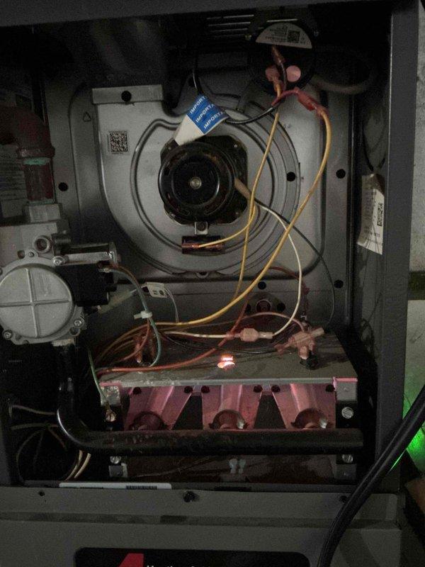 Performed routine tune-up on 20+ year old dual furnace system located in basement. Inspection revealed significant corrosion at plumbing pipe junctions with extensive rust buildup, particularly at metal/copper connection points. Internal examination of blower assembly and heat exchanger showed functional components, but recommended monitoring of corroded plumbing to prevent future failure.