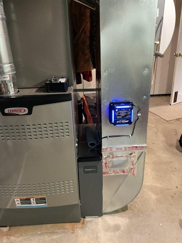 Relocated UV germicidal lamp to an alternate position on the Lennox furnace system for improved effectiveness. Verified proper operation of the UV bulb and associated control components after installation in the new location.
