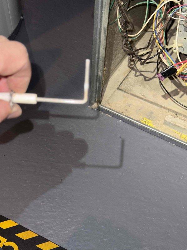 Conducted Gold Furnace Inspection on 19-year-old forced air system located in basement. Inspected electrical wiring and connections in control panel, noting bundle condition and proper color coding. Examined adjacent Bradford White water heater with Defender Safety System, verifying proper ductwork connections and exhaust ventilation.