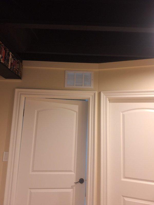 Completed installation of code-compliant combustion air openings in furnace/water heater mechanical room to address City violation. Installed two properly sized ventilation registers (minimum 100 square inches each) - one at ceiling level and one at floor level - providing the required 1 square inch of opening per 1000 BTU of appliance input.