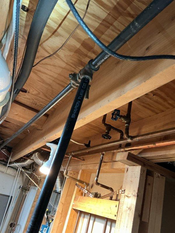 Completed re-routing of gas line to first floor for dryer installation. Installed new Gastite flexible gas piping through ceiling joists and wall cavity, connecting to existing gas supply. Performed pressure test on completed gas line installation to verify system integrity and absence of leaks.