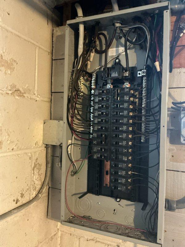 Performed comprehensive electrical system inspection as part of whole-home electrical special, including examination of exterior utility connections (Honeywell control box and digital meter) and interior circuit breaker panel. Conducted thorough assessment of the main panel, identifying multiple circuit breakers and verifying proper wire connections throughout the system.