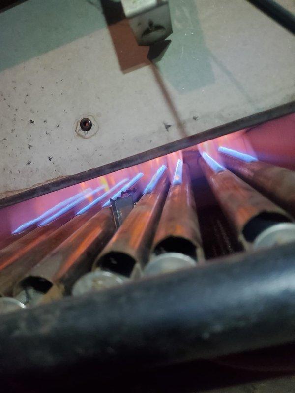 Performed comprehensive boiler inspection and maintenance on aging steam boiler system (10+ years old). Inspected burner assembly, confirming proper flame pattern and heat exchanger function. Examined all connections, controls, and safety systems; system is operational but customer's maintenance plan requires renewal for continued coverage.