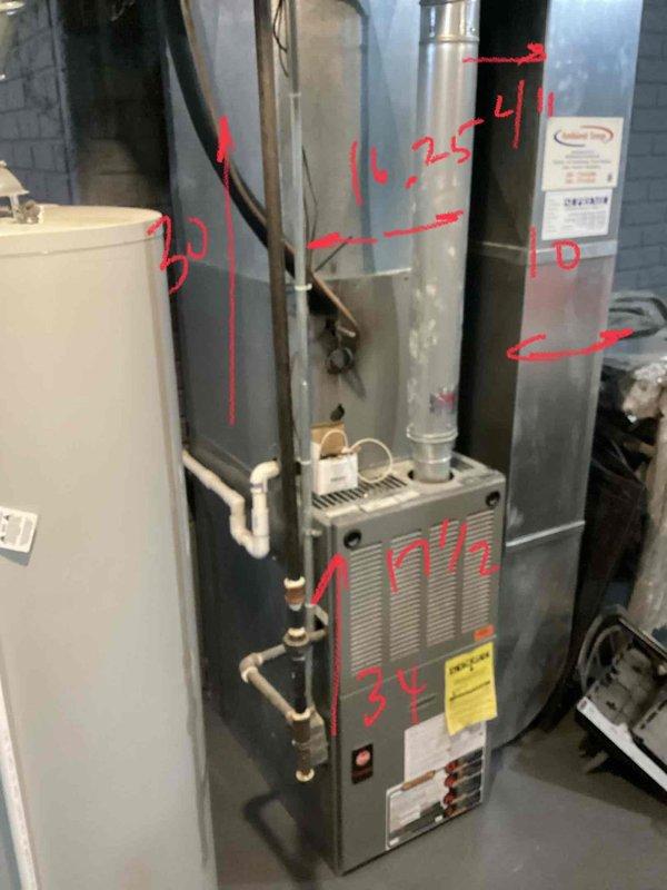 Inspected 19-year-old furnace in basement showing multiple critical failures including oil leakage from blower motor, signs of leakage from inducer motor, and dark rust spots on heat exchanger. Noted excessive dirt accumulation in system due to ongoing home construction. Recommended complete furnace replacement with option to replace AC system as well given the 21-year age of the complete HVAC system.