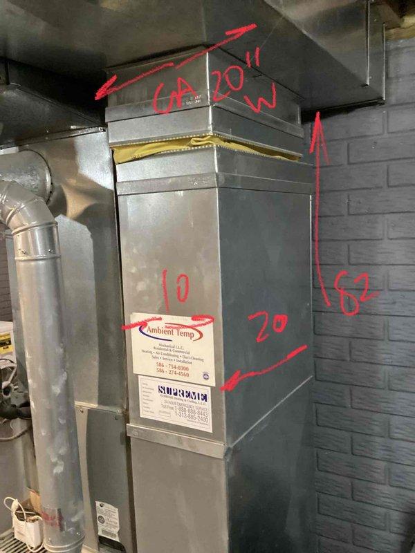 Inspected 19-year-old furnace in basement showing multiple critical failures including oil leakage from blower motor, signs of leakage from inducer motor, and dark rust spots on heat exchanger. Noted excessive dirt accumulation in system due to ongoing home construction. Recommended complete furnace replacement with option to replace AC system as well given the 21-year age of the complete HVAC system.