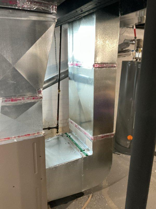 Conducted a comprehensive full system HVAC estimate for residential air conditioning installation. Inspected existing utility space and evaluated appropriate placement for new furnace unit with proper ductwork configuration. Documented current setup with photos showing metal ductwork installation points and potential furnace location on wooden platform in basement area.