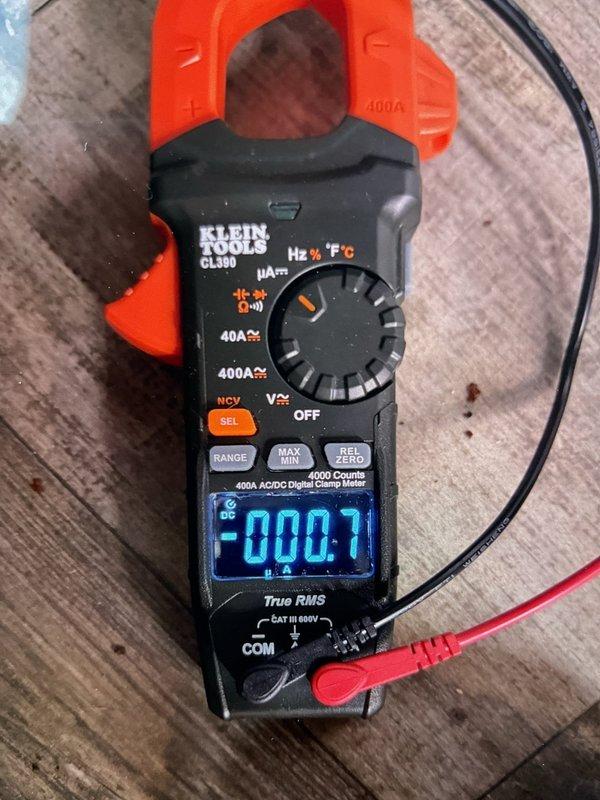Responded to service call for 2019 furnace that was not achieving setpoint temperature despite thermostat replacement. Diagnostic testing revealed improper voltage readings at the control board terminal connections, with measurements taken using a Klein Tools CL390 clamp meter. After inspecting and reconnecting the color-coded wiring (blue, white, red, green, yellow) at the terminal block, system operation was restored to normal function with proper temperature control.