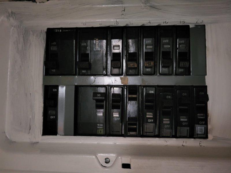 Conducted assessment of non-operational furnace with failed inducer motor. Found existing unit (approximately 9 years old) was improperly installed, having been relocated from another property. Evaluation included inspection of electrical panel and outdoor AC unit, which showed signs of age and seasonal debris accumulation. Provided replacement estimate for new furnace system with optional AC replacement.