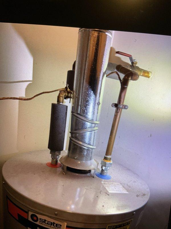 Performed a Gold Furnace Inspection on a forced air system located on the main floor. Visual inspection revealed operational burners with proper flame characteristics and heat exchanger integrity. Also noted a State brand water heater with standard plumbing configuration and pressure relief valve in working condition.