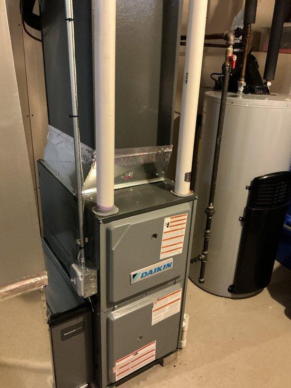 Responded to warranty service call for skunk odor returning through the HVAC system in a residence with a Daikin furnace under 3 years old. Inspected the unit and associated ductwork in the basement, which appeared properly installed and in good condition. Determined source of odor infiltration and resolved the issue to prevent further skunk smell from entering the home through the ventilation system.