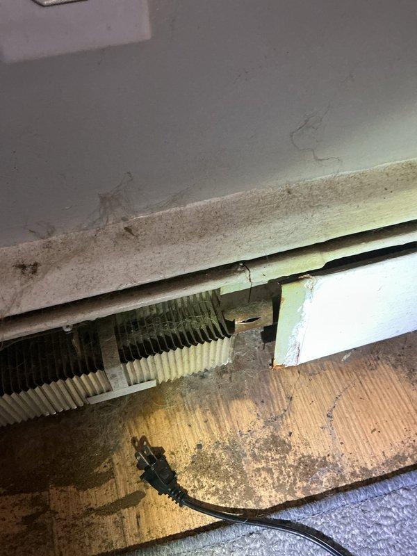 Responded to no-heat call for non-gold boiler. Inspection revealed significant corrosion and deterioration of heat exchanger components with visible oxidation and discoloration. Baseboard heating units showed accumulated dust and debris on fins, reducing heat transfer efficiency.