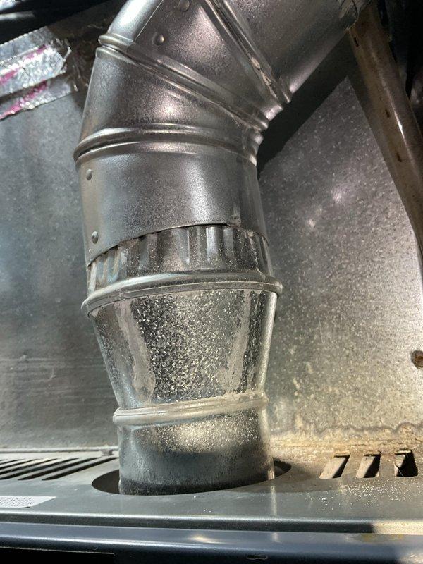 Responded to no heat call for 15-year-old furnace with inconsistent heating performance. Diagnostic inspection revealed significant condensation on ductwork and elbow joints of the HVAC system. Addressed moisture buildup on metal components, serviced the system, and restored proper heating operation.