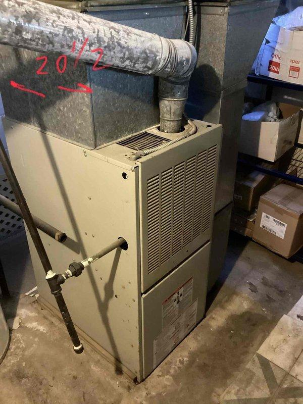 Conducted comprehensive assessment of existing heating system in basement, which features a 2012 gas furnace with connected ductwork. Customer requires complete HVAC replacement including installation of new furnace unit and addition of AC system (currently not present). Documented current installation configuration and measured existing connections to ensure proper sizing for replacement equipment.