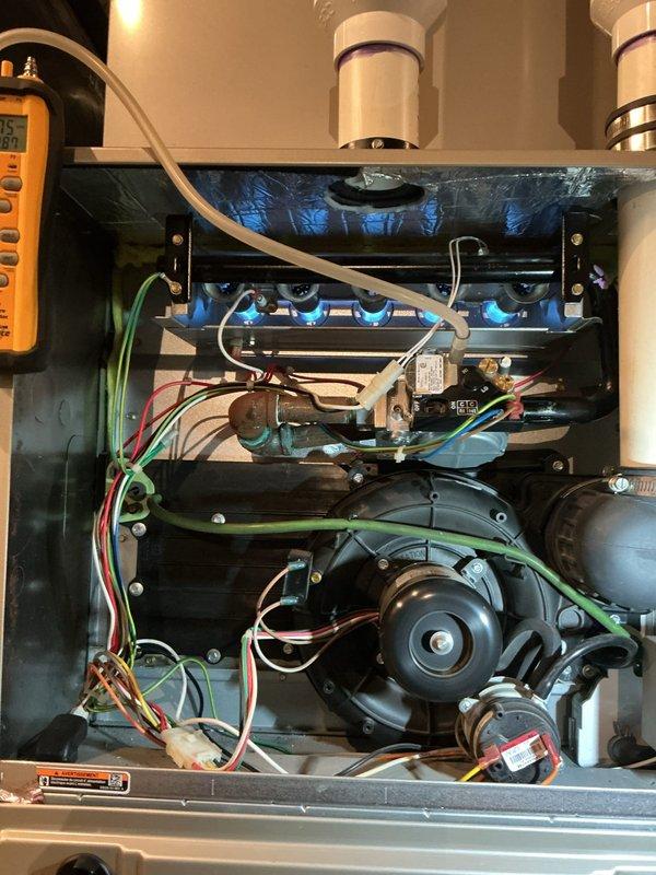 Diagnosed intermittent heat issue on 4th service call since January. Inspected burner assembly, observed proper blue flame pattern, and verified gas valve operation using multimeter. Adjusted airflow settings on Bryant Evolution Connex thermostat from "comfort" to "efficiency" mode and enabled "low heat rise" option to optimize system performance.