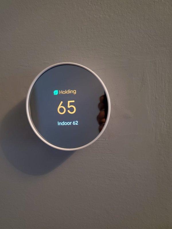 Responded to service call for furnace cycling issue in 10+ year old basement unit. Diagnosed short cycling problem caused by dirty flame sensor preventing proper ignition sequence. Cleaned flame sensor, verified proper ignition timing and heat distribution, and confirmed thermostat was properly calibrated with indoor temperature reading 3 degrees below set point (65°/62°).