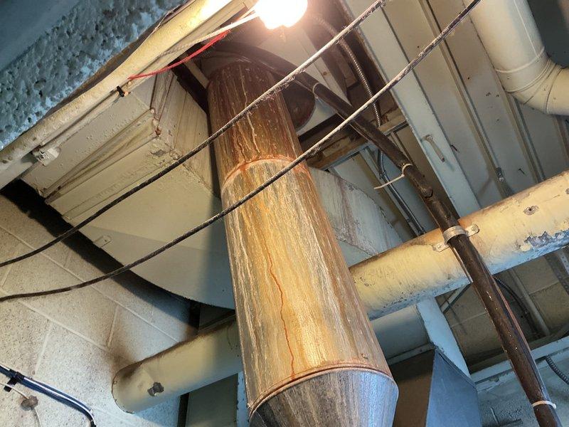 Completed installation of a new Bradford White 40-gallon commercial water heater, replacing the heavily corroded existing unit. Work included installing new dielectric unions, 3/4" ball valve shutoff on feed line, new gas valve and piping, and replacing the vent wye with a new 5x4x4 wye to reconnect existing furnace venting. Unit was elevated on bricks, filled, tested for proper operation, and verified leak-free.