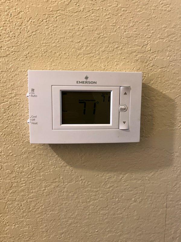 Conducted a full system evaluation of existing HVAC equipment per customer's request for replacement quote. Current furnace and AC units are operational with no immediate issues noted. Inspected thermostat (Emerson digital model, set at 77°F) and examined interior air handler installation with accessible panel configuration. Equipment is functioning properly; customer seeking proactive replacement options rather than addressing performance concerns.