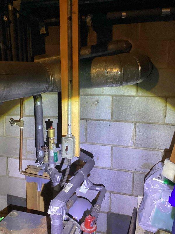 Inspected customer's boiler system per service request. Identified damaged insulation on vertical pipe with areas of exposed metal and inadequate sealing. Observed existing ductwork configuration and examined valve assemblies and pressure regulation components for proper functionality.