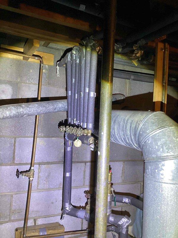 Inspected customer's boiler system per service request. Identified damaged insulation on vertical pipe with areas of exposed metal and inadequate sealing. Observed existing ductwork configuration and examined valve assemblies and pressure regulation components for proper functionality.