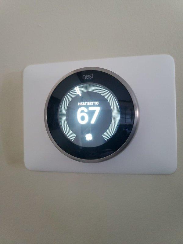 Performed diagnostic assessment on 6-year-old heating system that was running but failing to maintain temperature. Inspected gas burner assembly which showed proper blue flame pattern and normal operation. Verified thermostat functionality and confirmed Nest smart thermostat was correctly communicating with the system. Determined issue was related to improper system cycling causing temperature drops; adjusted control parameters and verified continuous operation through complete heating cycle.