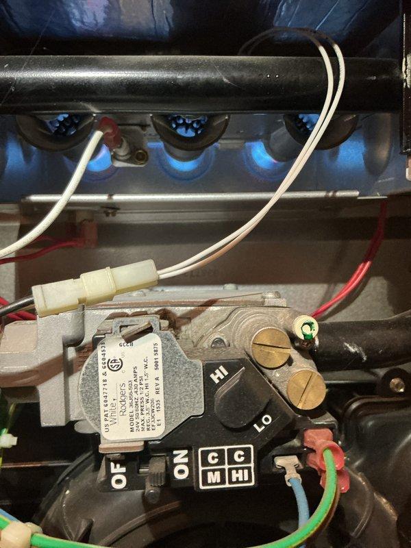 Completed Gold Furnace Inspection on 10+ year old residential basement furnace. Verified proper burner operation with clean blue flame pattern and inspected gas valve assembly functionality. Examined Honeywell humidifier installation and confirmed proper connection to ductwork; noted presence of Filtrete filtration system.
